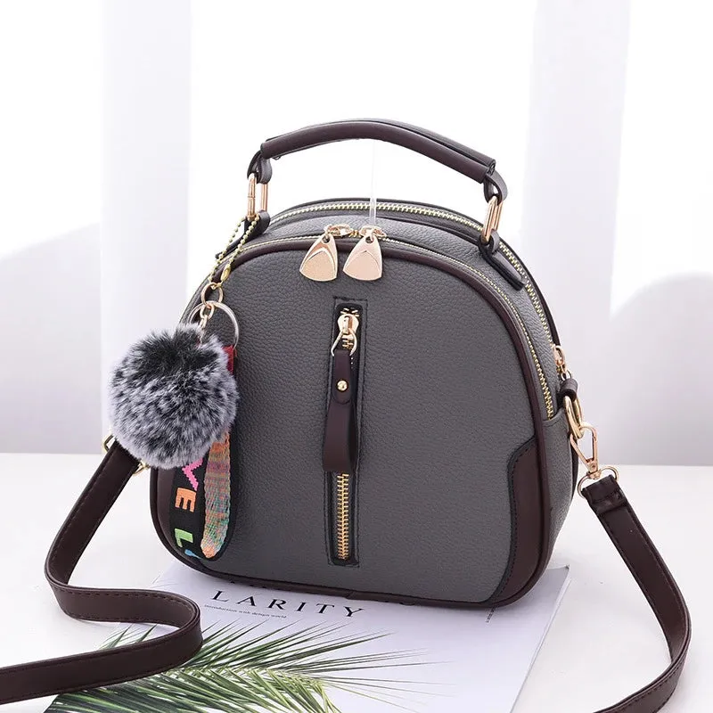 Chic Black Round Tote with Fur Charm