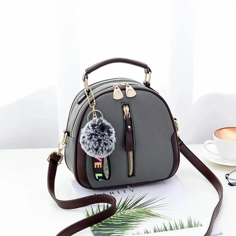 Chic Black Round Tote with Fur Charm