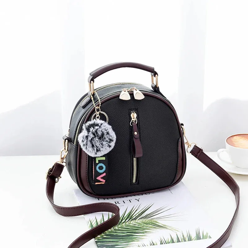 Chic Black Round Tote with Fur Charm