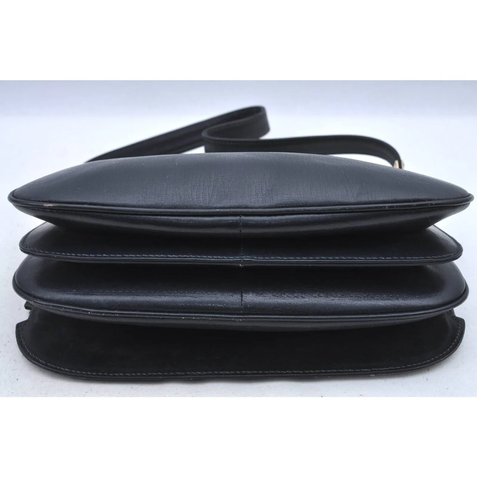 Gucci 60's navy leather saddle bag with gold logo clasp
