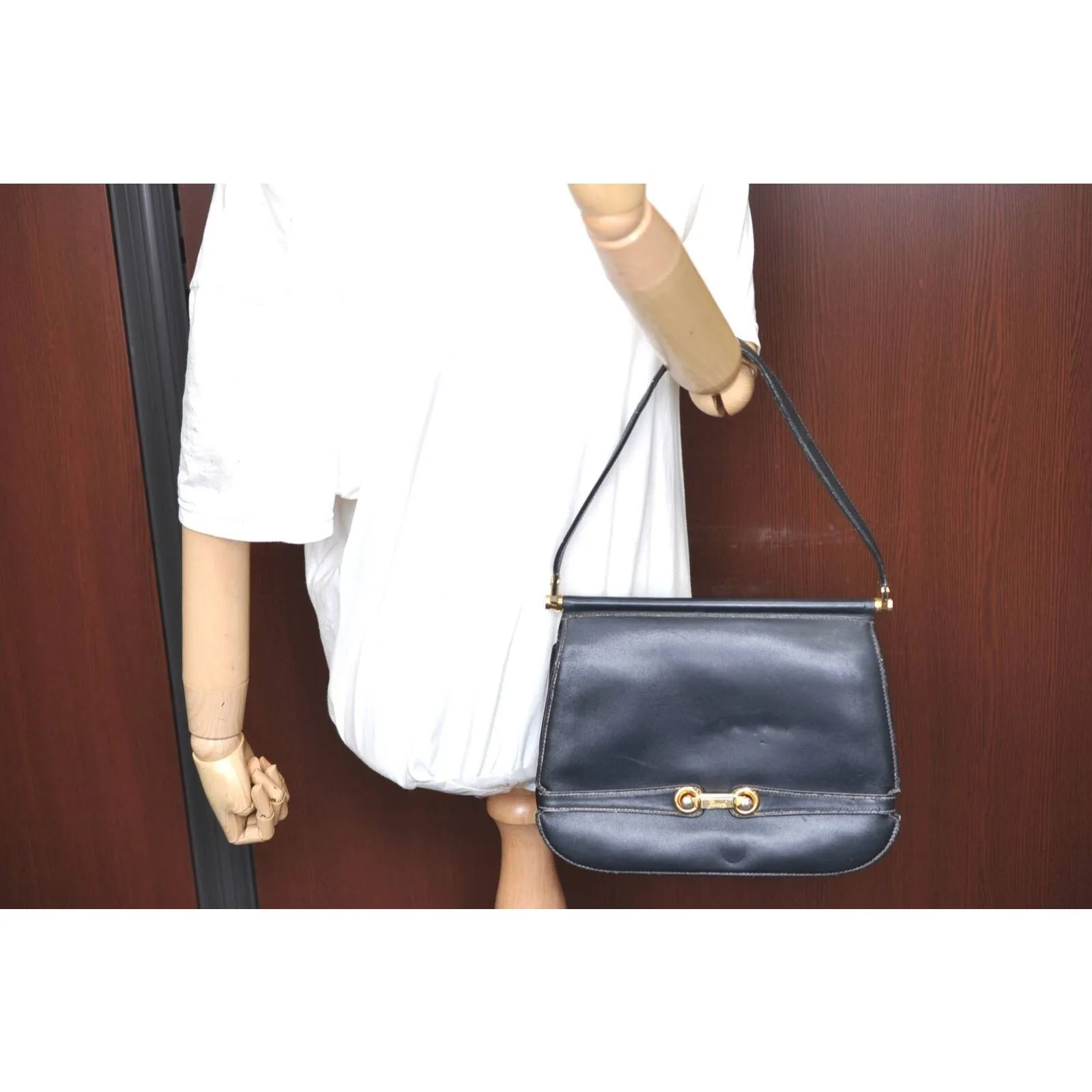 Gucci 60's navy leather saddle bag with gold logo clasp
