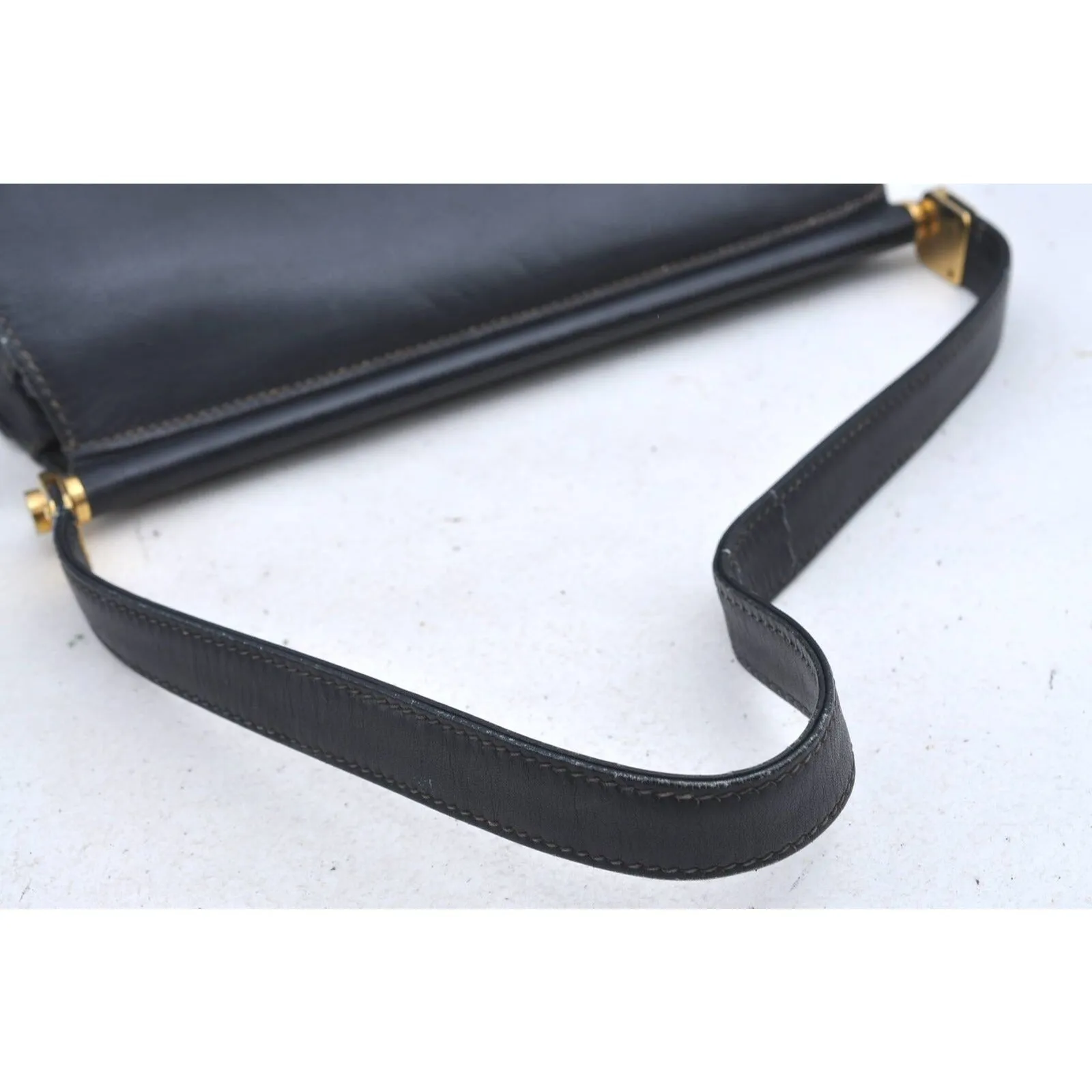 Gucci 60's navy leather saddle bag with gold logo clasp