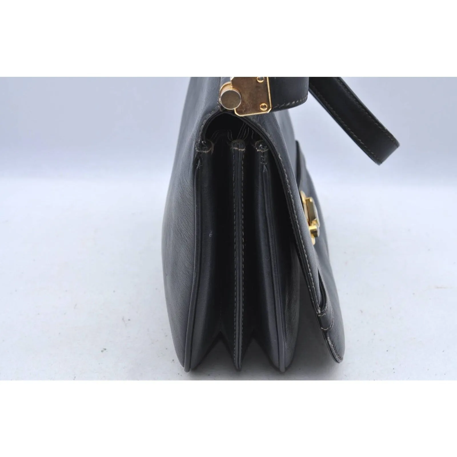 Gucci 60's navy leather saddle bag with gold logo clasp